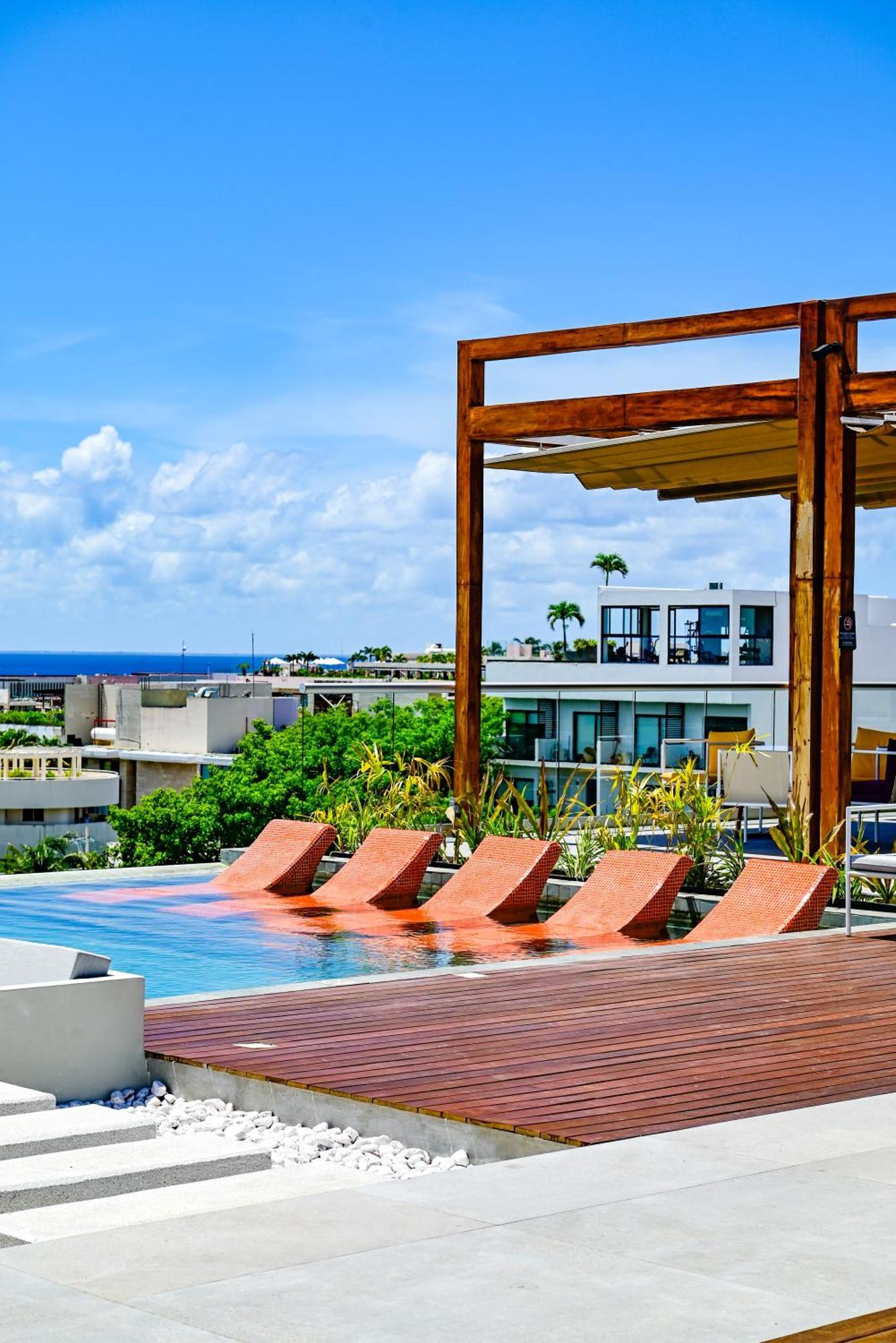 Aloft Playa Del Carmen Hotel Exterior photo Rooftop pool at the Hotel Habitas Tulum